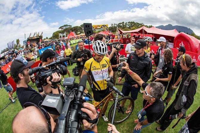 Christoph Sauser of Burry Stander-Songo getting swamped by media