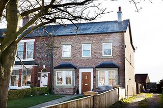 three bedroom house with an open-plan bedroom bathroom in the loft