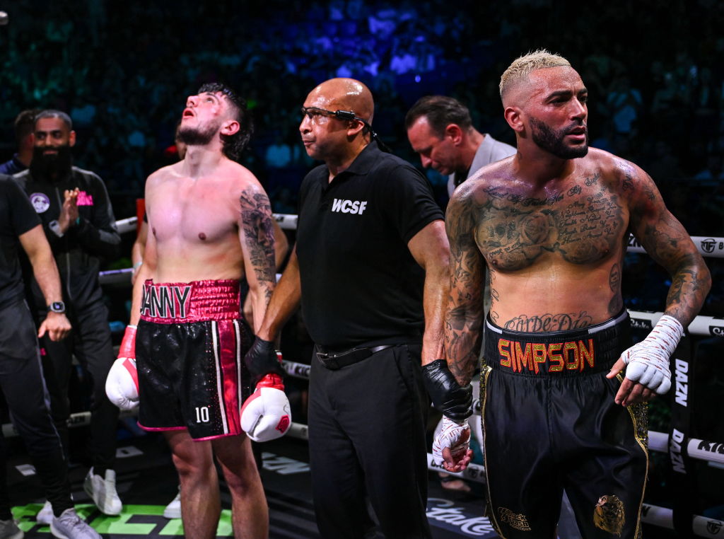 Danny Simpson, right, and Danny Aarons react after their light heavyweight bout is announced as a draw during the Misfits Boxing & DAZN X Series at the 3Arena in Dublin