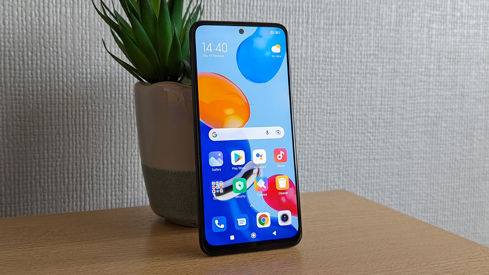 Xiaomi Redmi Note 11 facing forward with the screen on.