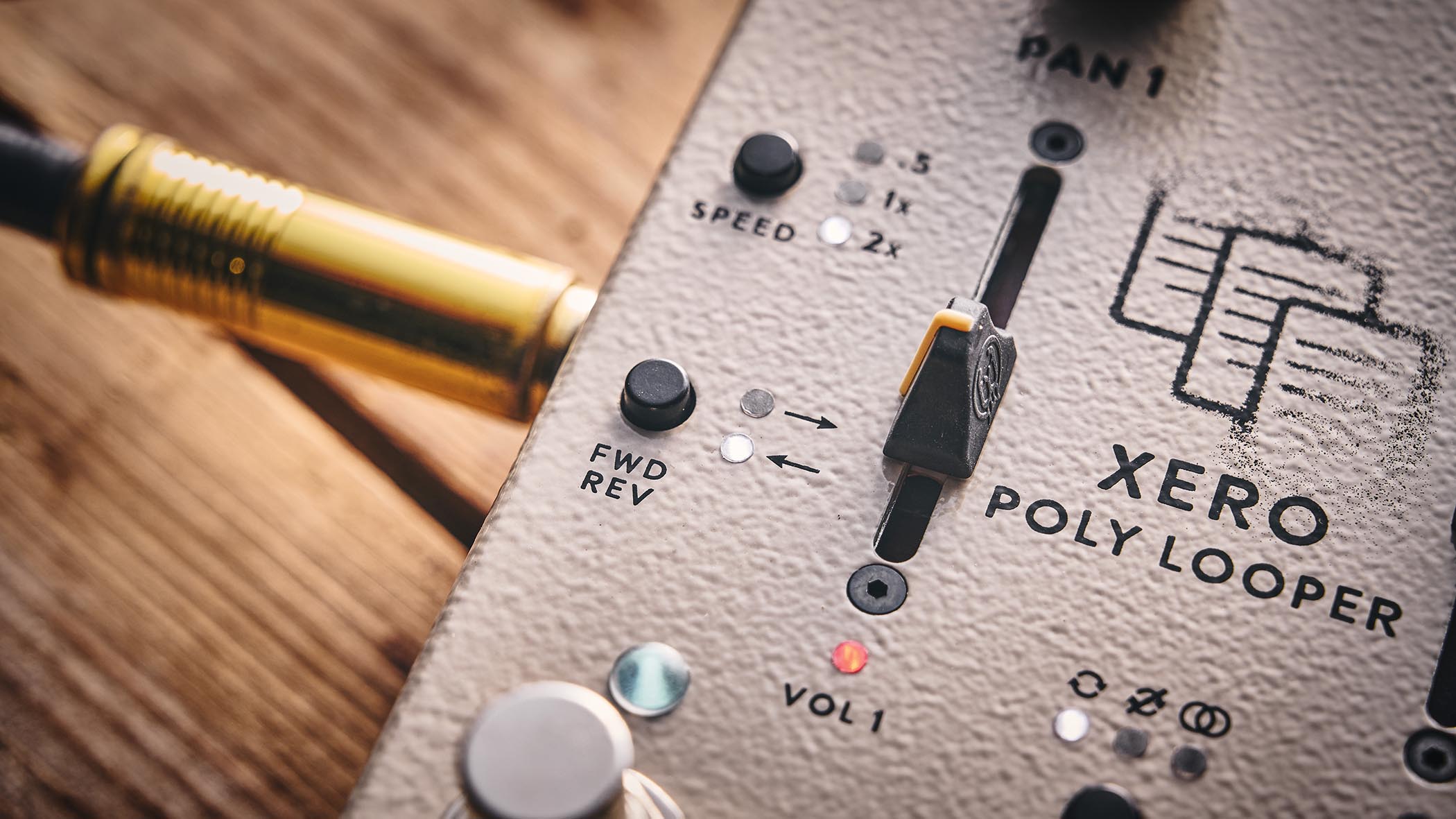 Walrus Audio Xero Polylooper: the dual-slider and footswitch looper is photogaphed against a wooden floor.