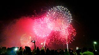 Crowds watching Macy's Fourth of July fireworks display, Manhattan