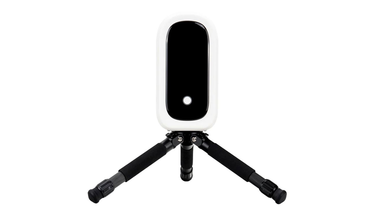 The ZWO Seestar S50 Pro smart telescope on a small black tripod, showing the power button, against a white background.