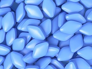 An image of diamond-shaped blue pills.
