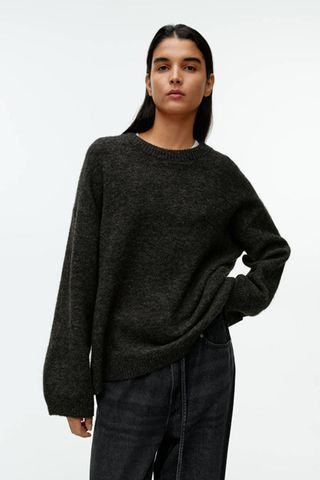 grey jumpers woman wearing dark grey fluffy wool knit