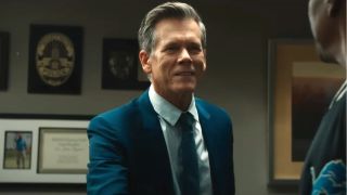 Kevin Bacon smiles while standing in his office in Beverly Hills Cop: Axel F.