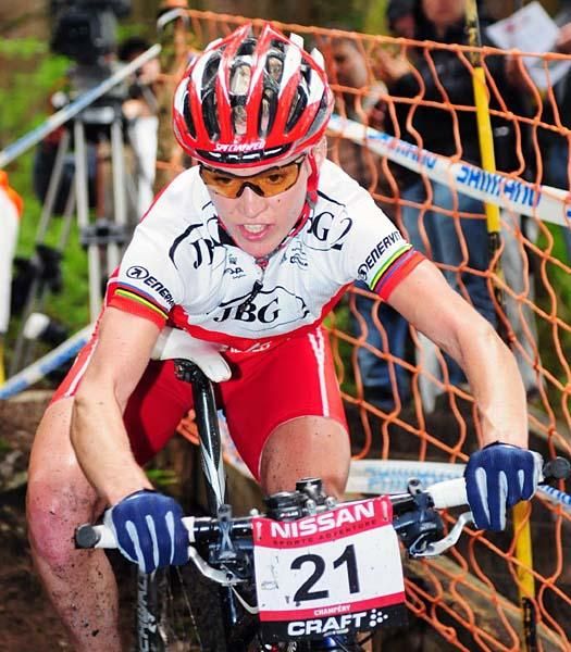 Anna Szafroniec (JBG-2) leans on her saddle while descending.