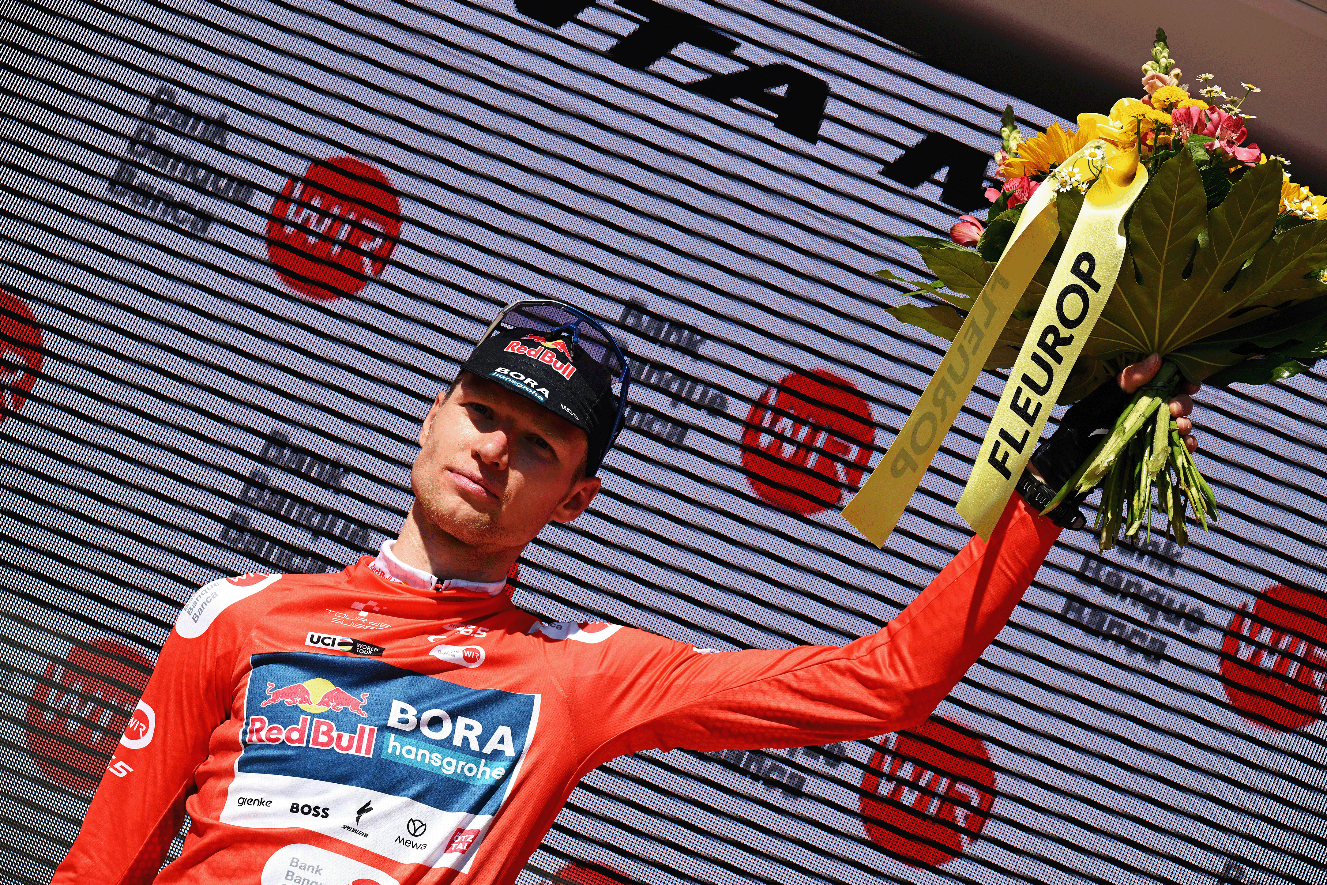 SANTA MARIA IN CALANCA, SWITZERLAND - JUNE 19: Aleksandr Vlasov of Russia and Team Red Bull - BORA - hansgrohe celebrates at podium as Red Mountain Jersey winner during the 88th Tour de Suisse, Stage 5 a 183.8km stage from La Punt to Santa Maria in Calanca 941m / #UCIWT / on June 19, 2025 in Santa Maria in Calanca, Switzerland. (Photo by Tim de Waele/Getty Images)