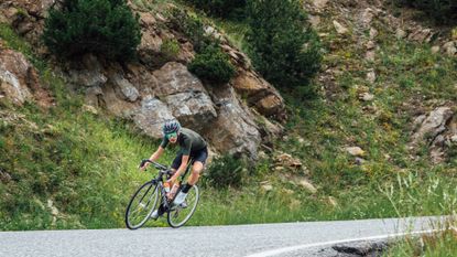 Image shows rider descending as part of his cycling fitness goals
