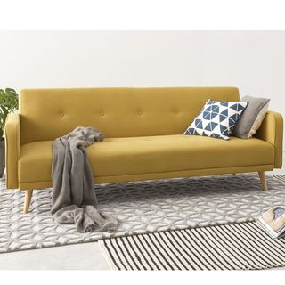 chou sofa bed with white walls cushion and cover