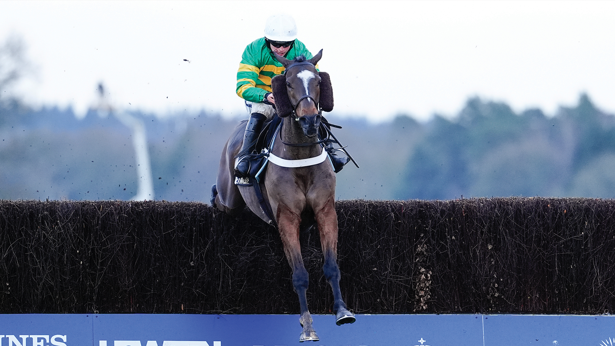 James Bowen riding Jonbon clear the last to win The BetMGM Clarence House Chase at Ascot Racecourse