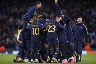 Real Madrid celebrate their penalty-shootout success against Manchester City.