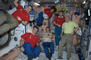 Expedition 26 'toasts' to the New Year as 2011 begins on the International Space Station. Taken Jan. 1, 2011.