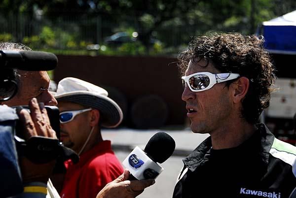 Roman Urbina interviewed by media at the finish line.