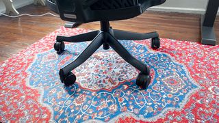 An office chair on a desk chair mat