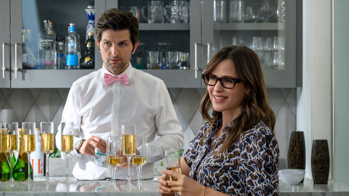 Adam Scott serving at the bar and Jennifer Garner with a drink in Party Down