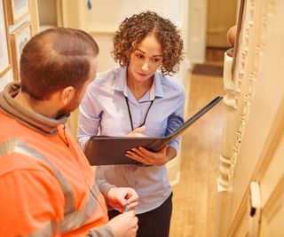 woman carrying out house survey