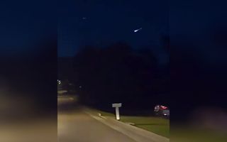 A brilliant fireball lights up the night sky over Knoxville, Tennessee, in this cell phone video captured from a moving vehicle by witness Austin R. at 9:42 p.m. EDT on June 7, 2020 (0142 GMT June 8).