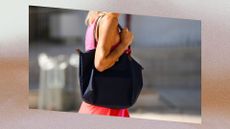 person carrying a longchamp le pliage bag in navy