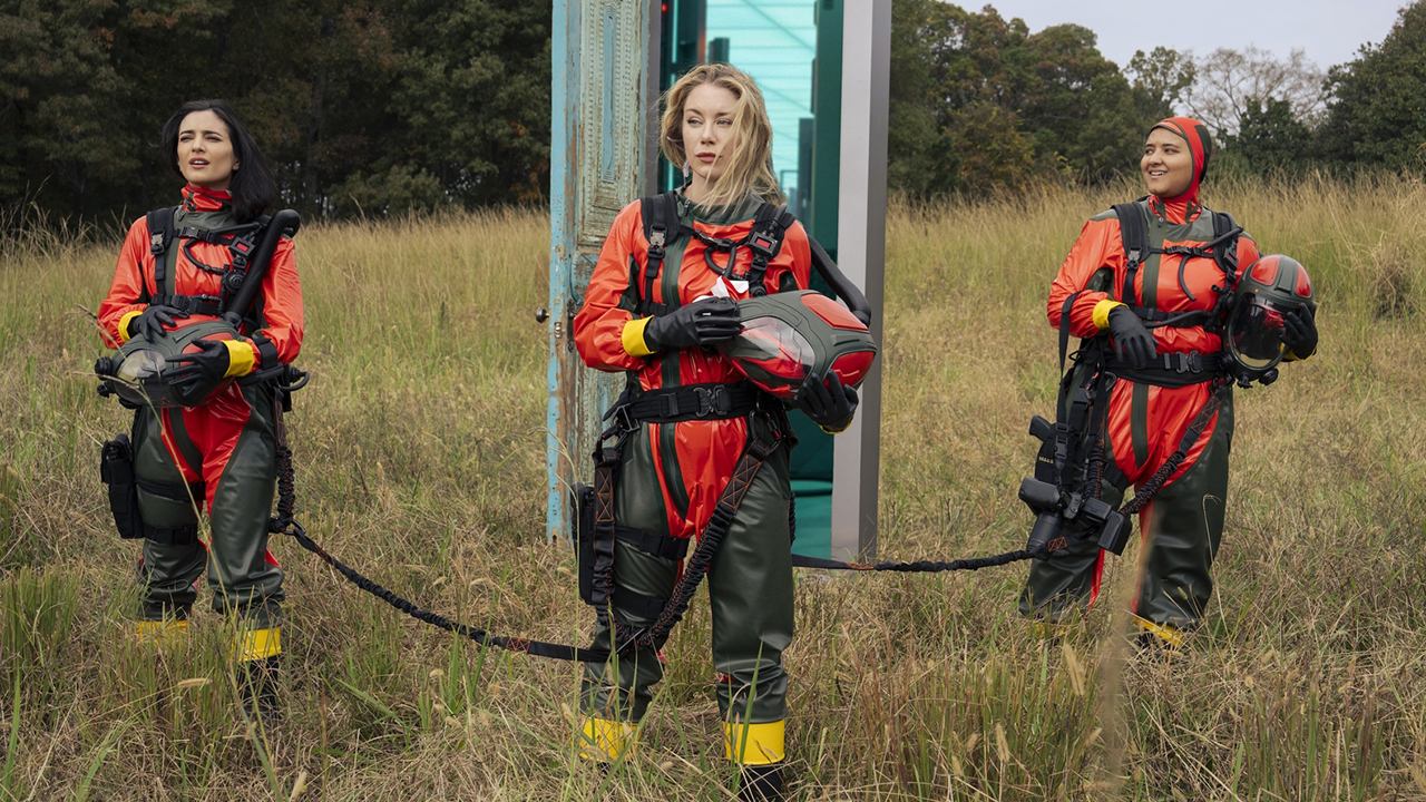 Sasha Bordeaux, Emilia Harcourt, and an ARGUS agent standing in a field in Peacemaker season 2 episode 8