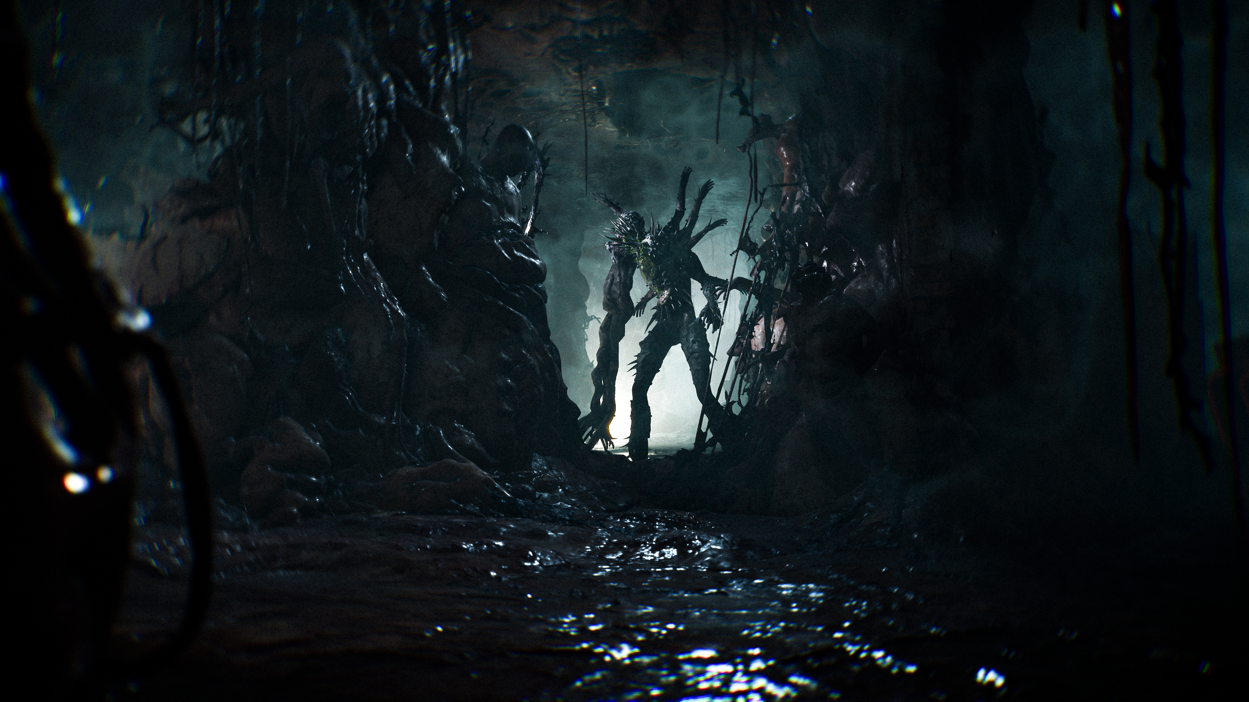 A screenshot shows a hulking monster leaning over a dark pit of slime