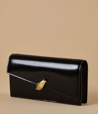black bag with gold hand
