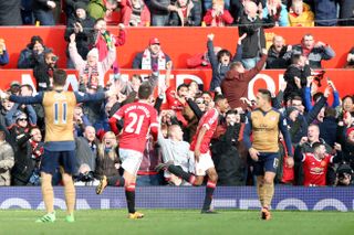 Manchester United’s Marcus Rashford (centre) celebrates scoring on his Premier League debut against Arsenal