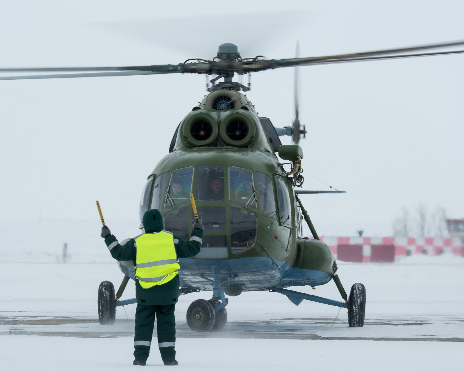A Russian MI-8 helicopter is seen at the Karanganda Airport shortly after poor weather forced the fleet of 12 helicopters to turn around from their flight to Zhezkazgan, Kazakhstan where they were to have pre-staged for the landing of the Soyuz TMA-10M sp