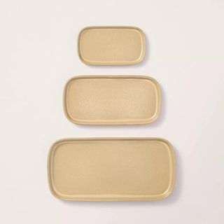 Three ceramic trays in ascending sizes