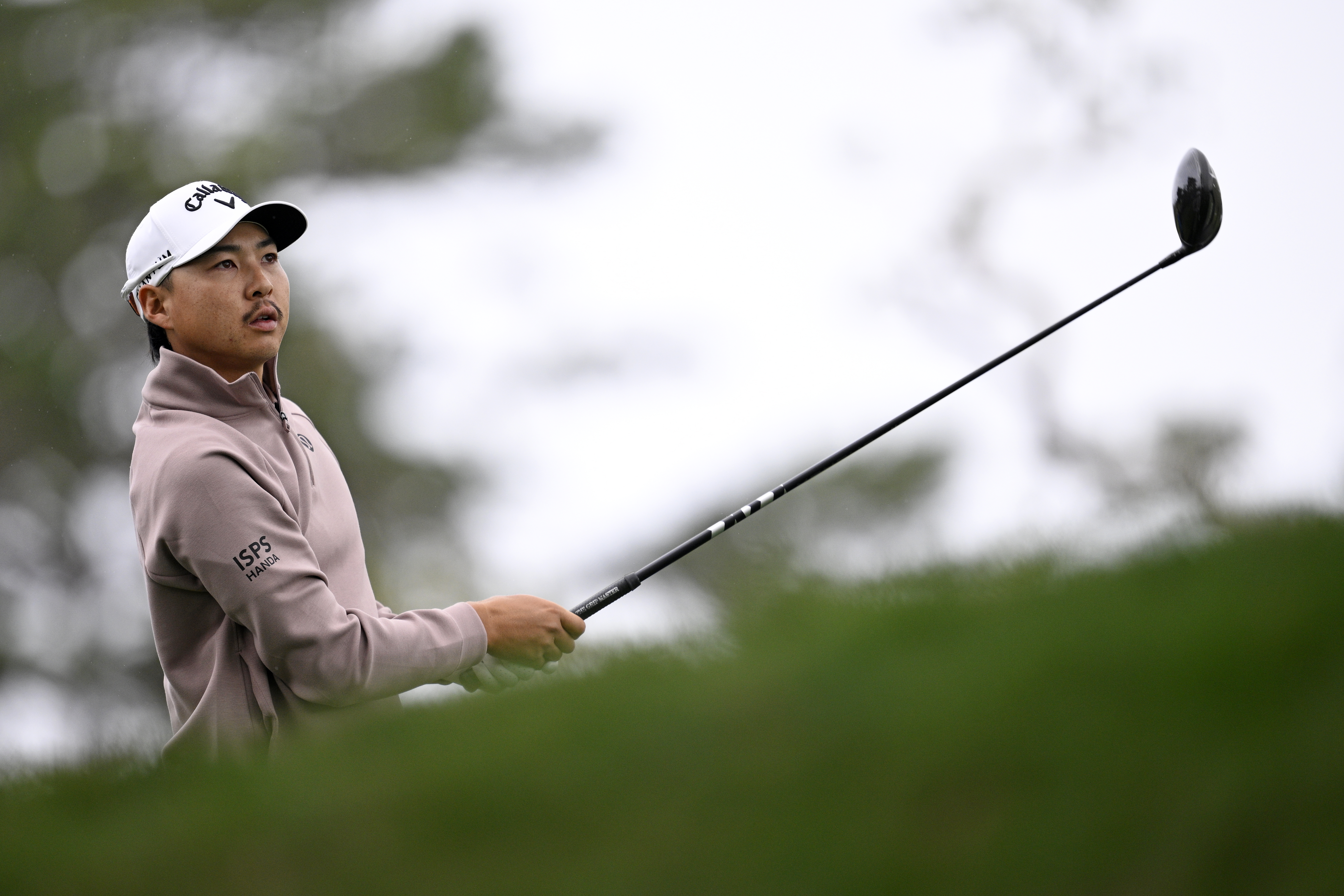 Min Woo Lee hits a driver off the tee