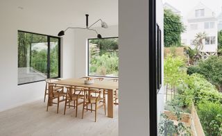 An extension at the back features large openings, looking out to the landscaped garden by Garden Route Company.