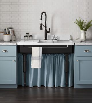 pastel blue kitchen with sink skirt