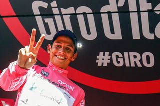 Esteban Chaves celebrates in pink on the stage 19 podium