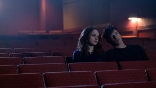 Tessa (Joey King) and Skylar (Kyle Allen) sit alone in a movie theater in The In Between.