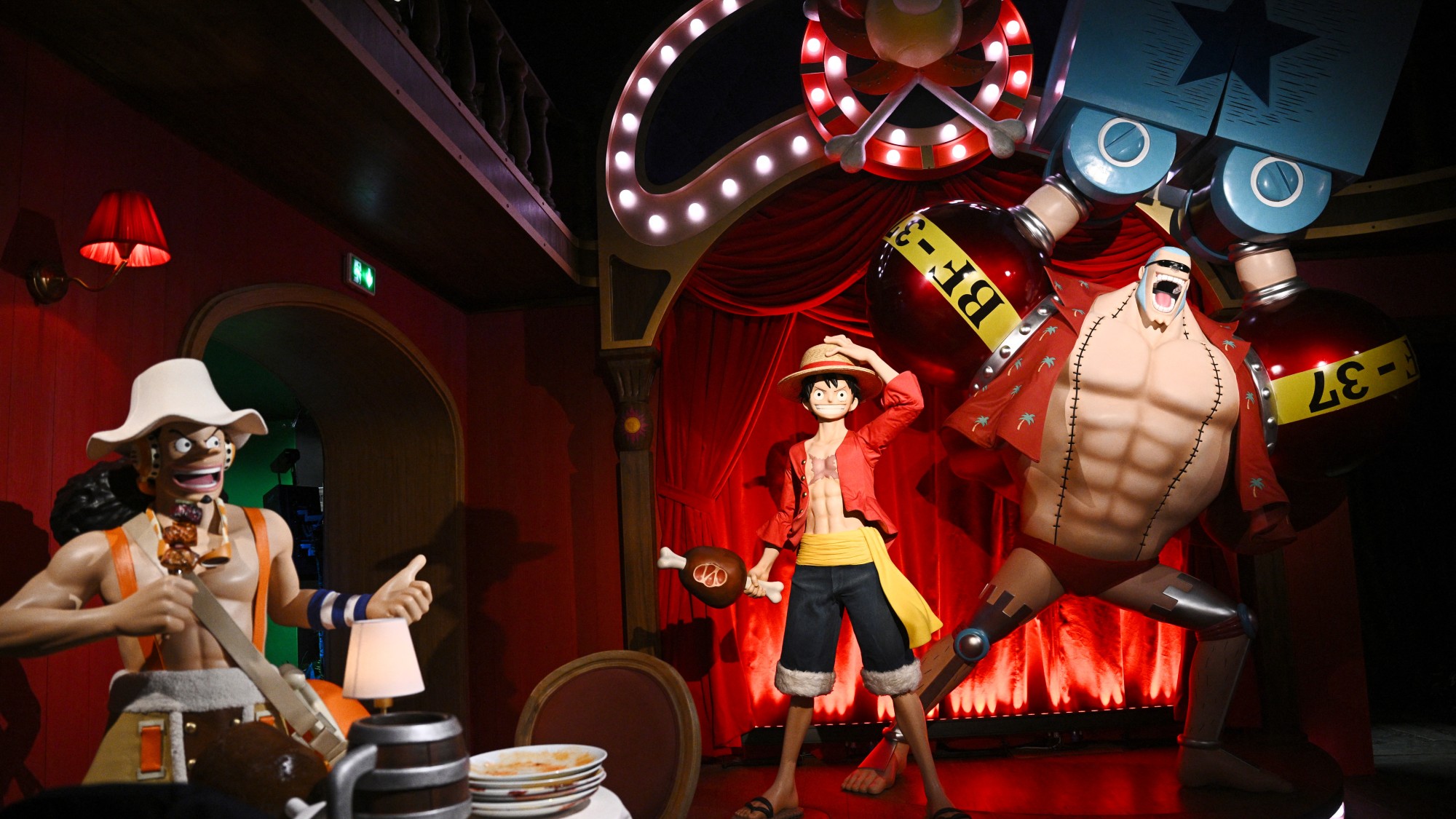 Wax effigies of One Piece's characters Usopp (L), Monkey D. Luffy (C) and Franky in a room dedicated to the series during their inauguration at the Musee Grevin in Paris