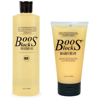 Two bottles of boos block oil and cream for chopping boards with black lids