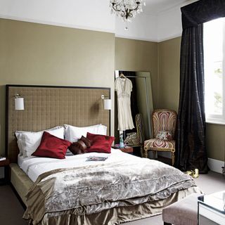 bedroom with chandelier and bed