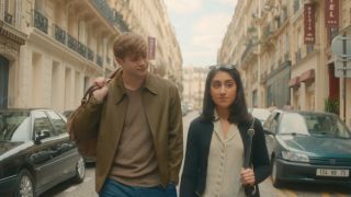 Dex and Emma walking in Paris in Netflix's One Day