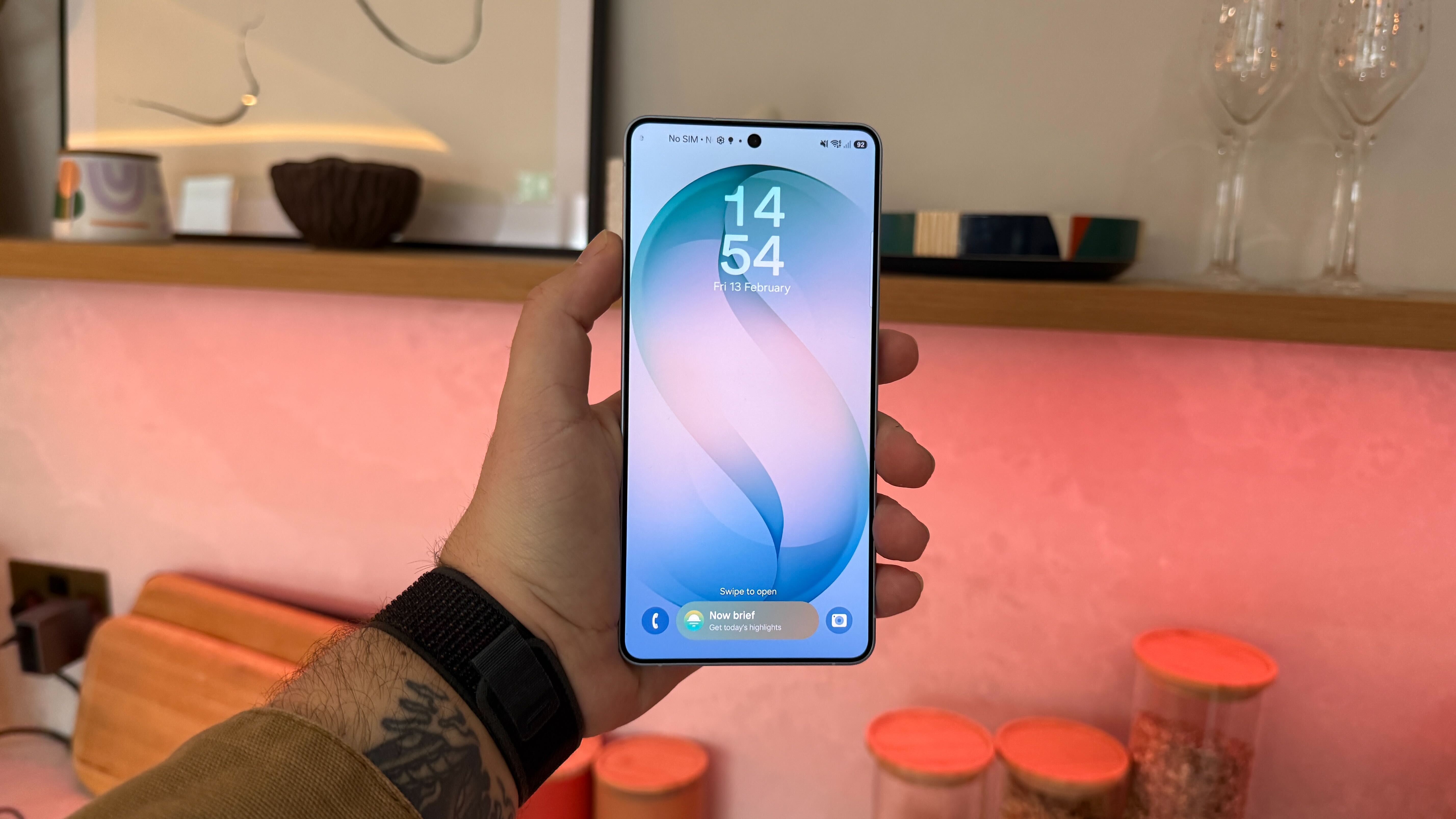 A Samsung Galaxy S26 Ultra smartphone in a modern home environment