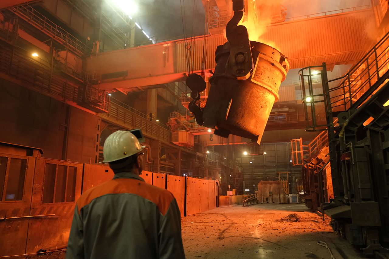 SALZGITTER, GERMANY - MARCH 05: A worker watches as a ladle recedes after pouring molten iron into a converter for creating steel at the Salzgitter AG steelworks on March 05, 2019 in Salzgitt