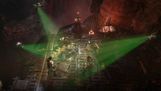 Warhammer 40K: Dark Heresy screenshot showing a group investigating a crime scene where a body lays on the ground and green lights shine on it 