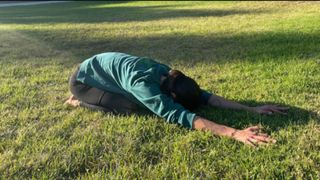 Woman doing the childs pose stretch