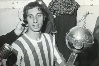 Carlos Bilardo holds the Copa Libertadores trophy after winning the continental competition with Estudiantes in May 1969.