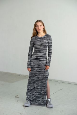 Portrait of woman in stripe detail Missoni Maxi dress and JW Anderson sneakers
