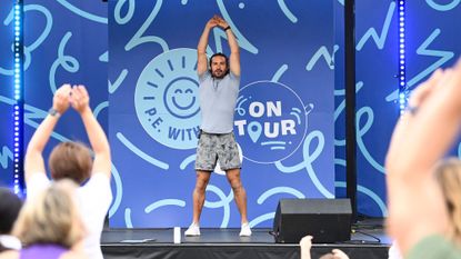 Joe Wicks workouts: The personal trainer performing a workout on stage