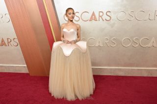 Ariana Grande attends the 97th Annual Academy Awards at the Dolby Theatre in Hollywood, California on March 2, 2025. She's wearing a structured light pink gown.