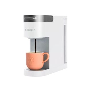 K-Slim Single Serve Coffee Maker in white with peach mug