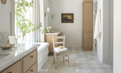 Beige bathroom with wooden accents and checkerboard tiles