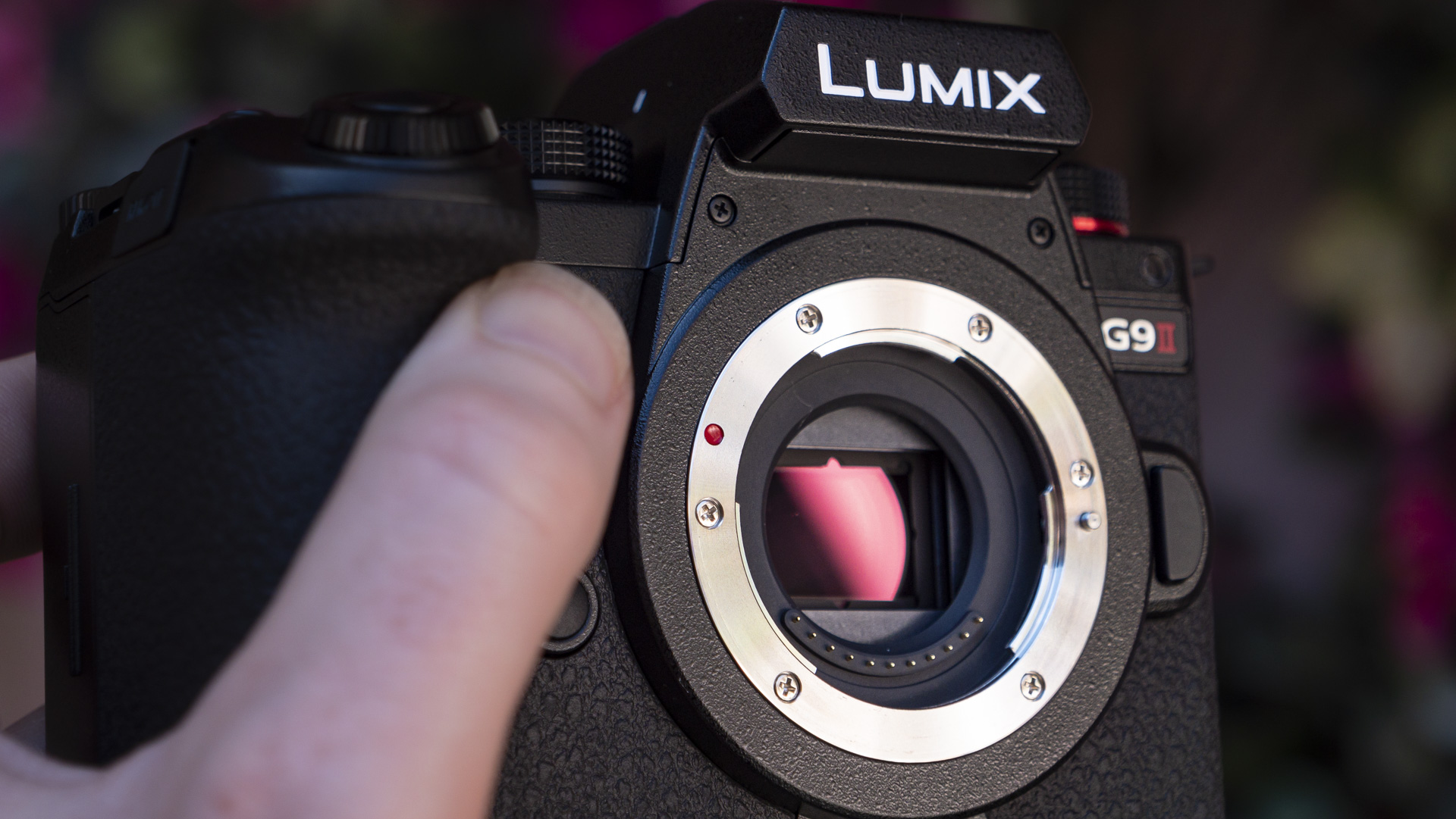 Panasonic Lumix G9 II camera in the hand with micro four thirds sensor in view