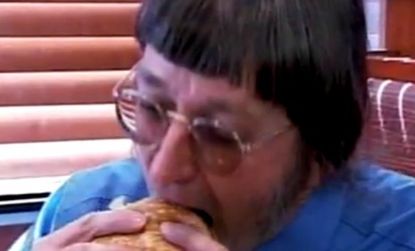 Don Gorske bites into his 25,0000 Big Mac, defying all nutritional odds by living on a nearly all-burger diet that he doesn't see ending any time soon.